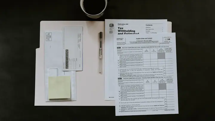 Driving licence and rental documents on a desk