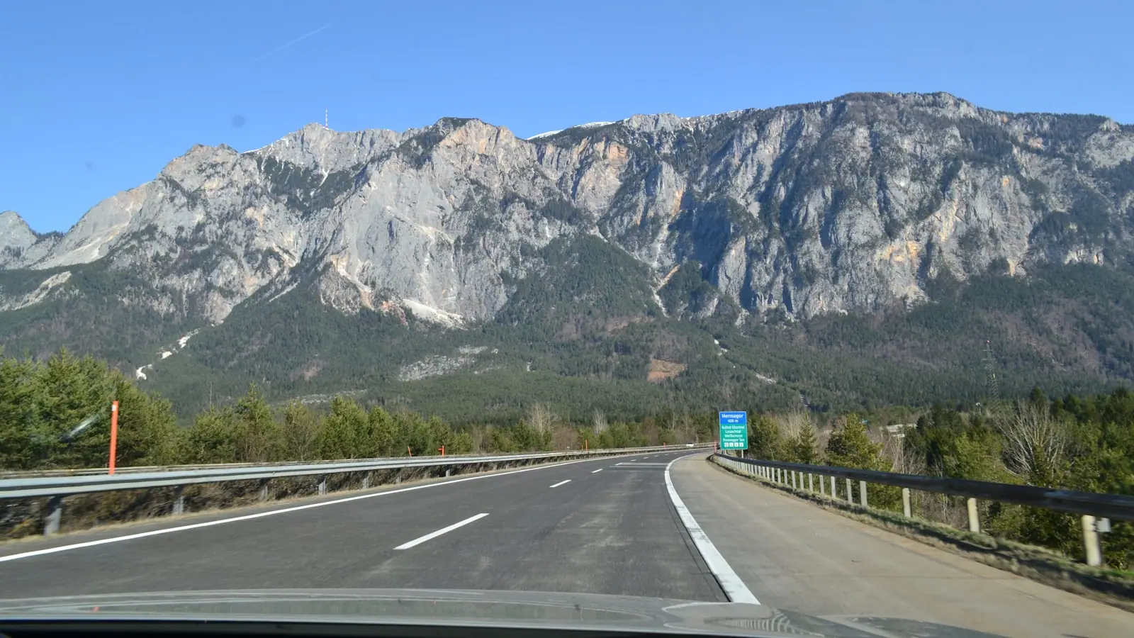 Calm, well-marked European highway with mountains ahead