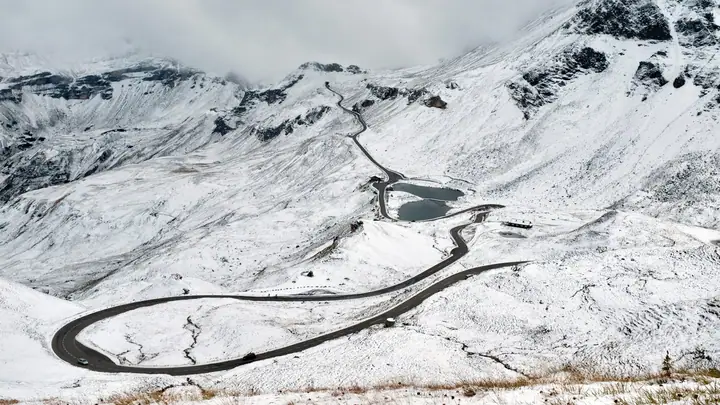 Snow-lined mountain road in the Alps in winter