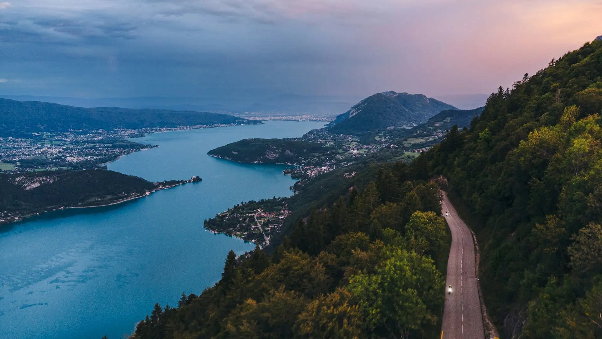Aerial view of a winding alpine road at first light