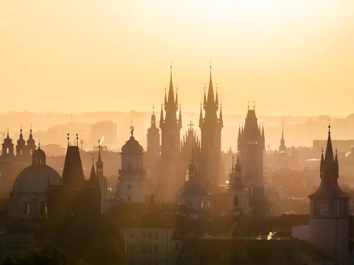 Rooftops and spires of Prague old town at sunset